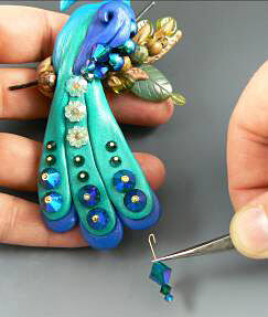Clay peacock tail feathers with glass beads